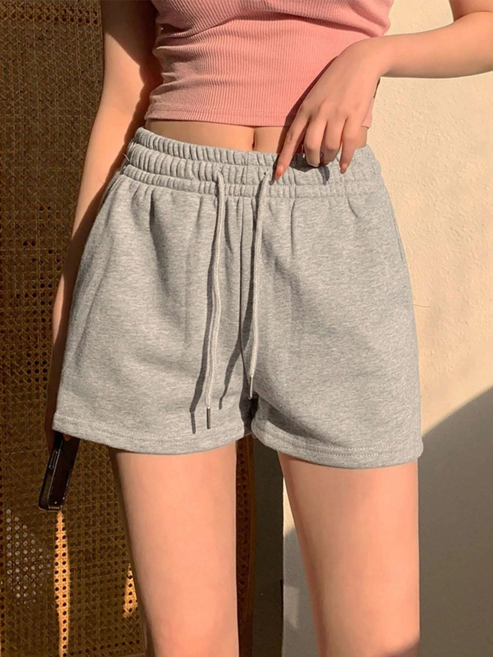 Women's solid color drawstring casual shorts, an ideal choice for everyday summer wear. Stylish loose-fitting athletic pants